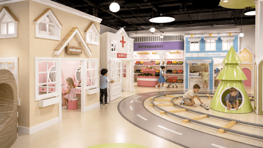 Interactive Role Play Environments Durable interactive role play environments built for commercial venues featuring custom retail storefronts and a miniature train track.